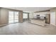 Open concept living room and kitchen with sliding glass door to backyard at 3760 Paseo De Paz Ave, Las Vegas, NV 89115