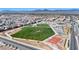 Aerial view of community green space featuring playground, basketball and tennis courts at 4039 Beech Fern Ave, North Las Vegas, NV 89084