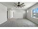 Spacious room with plush gray carpet, ceiling fan, and great bright view at 4039 Beech Fern Ave, North Las Vegas, NV 89084