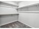 Walk in closet features neutral carpeting and built-in shelving to maximize organization and storage at 4039 Beech Fern Ave, North Las Vegas, NV 89084