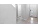 Foyer with gray walls, tile flooring, and a modern white door with glass accents at 4039 Beech Fern Ave, North Las Vegas, NV 89084