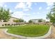 Lush green common area with walking paths, landscaping, and benches at 4039 Beech Fern Ave, North Las Vegas, NV 89084
