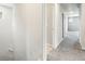 Upstairs hallway with neutral walls, carpet flooring and entryways to bedrooms and bathrooms at 4039 Beech Fern Ave, North Las Vegas, NV 89084