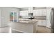 Modern kitchen featuring granite countertops, stainless steel appliances, and ample white cabinetry at 4039 Beech Fern Ave, North Las Vegas, NV 89084