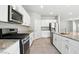 Well-equipped kitchen featuring modern appliances, granite countertops, and ample cabinet space at 4039 Beech Fern Ave, North Las Vegas, NV 89084
