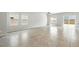 Bright and airy living room with tile flooring and abundant natural light at 4039 Beech Fern Ave, North Las Vegas, NV 89084