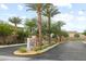 Community entrance sign with mature trees and drought-resistant landscaping at 4039 Beech Fern Ave, North Las Vegas, NV 89084