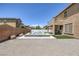 View of the backyard with pool, outdoor patio and gravel landscaping at 4225 Telstar Ct, North Las Vegas, NV 89032