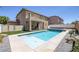 View of the private backyard with a pool and an outdoor patio area at 4225 Telstar Ct, North Las Vegas, NV 89032