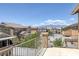 Inviting balcony with a view of mountains and surrounding neighborhood homes on a beautiful sunny day at 4225 Telstar Ct, North Las Vegas, NV 89032