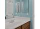 Bathroom view featuring a sink with vanity, dual mirrors and fixtures at 4225 Telstar Ct, North Las Vegas, NV 89032