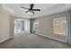 Spacious bedroom with neutral carpeting, recessed lighting, and outdoor access at 4225 Telstar Ct, North Las Vegas, NV 89032