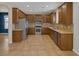 Spacious kitchen features stainless steel appliances, granite counters and ample cabinet space at 4225 Telstar Ct, North Las Vegas, NV 89032