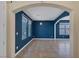 Living room showcasing tile floors, blue accent wall, and modern lighting at 4225 Telstar Ct, North Las Vegas, NV 89032