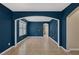 Spacious living room featuring tile floors and bold blue accent walls at 4225 Telstar Ct, North Las Vegas, NV 89032