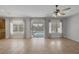 Bright living room with tile flooring and glass doors with backyard pool view at 4225 Telstar Ct, North Las Vegas, NV 89032