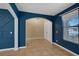 Living room features tile flooring, blue accent walls, and white trim at 4225 Telstar Ct, North Las Vegas, NV 89032