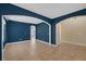 Living room showcasing tile floors and bold blue accent walls at 4225 Telstar Ct, North Las Vegas, NV 89032