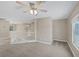 Open loft area with neutral carpeting, white railings, and natural light at 4225 Telstar Ct, North Las Vegas, NV 89032