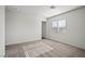 Bright bedroom with carpet floors, a large window, and neutral wall paint at 4245 Gold Desert St, North Las Vegas, NV 89032