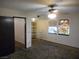 Bedroom featuring carpet and two windows at 5006 Schumann Dr, Las Vegas, NV 89146