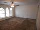 Spacious bedroom featuring carpet, windows, and ample natural light at 5006 Schumann Dr, Las Vegas, NV 89146