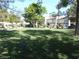 Landscaped community grounds with grass lawn and mature trees, offering a serene outdoor space at 5006 Schumann Dr, Las Vegas, NV 89146