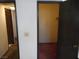 Hallway featuring multiple doors and access to storage spaces at 5006 Schumann Dr, Las Vegas, NV 89146