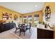 Cozy dining area features a round table, six chairs, and a beverage center at 5095 E Long Leaf Ct, Pahrump, NV 89061