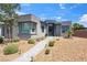 Modern home exterior with desert landscaping and a paved walkway leading to the front door at 5095 E Long Leaf Ct, Pahrump, NV 89061