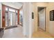 Bright foyer with tile flooring, a white front door, and decorative wall art at 5095 E Long Leaf Ct, Pahrump, NV 89061