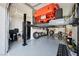 Well-equipped garage featuring a car lift with a classic car and ample storage solutions at 5095 E Long Leaf Ct, Pahrump, NV 89061