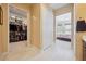 Spacious hallway with access to a large walk-in closet and a comfortable bedroom at 5095 E Long Leaf Ct, Pahrump, NV 89061