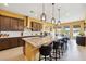 Modern kitchen features a large island, granite countertops, stainless steel appliances, and ample storage at 5095 E Long Leaf Ct, Pahrump, NV 89061