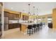 Spacious kitchen features a large island with seating, stainless steel appliances, and modern lighting at 5095 E Long Leaf Ct, Pahrump, NV 89061