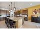Spacious kitchen with granite countertops, stainless appliances, and bar seating, perfect for entertaining at 5095 E Long Leaf Ct, Pahrump, NV 89061
