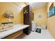 Bright laundry room features a sewing station, washer, dryer, and ample storage at 5095 E Long Leaf Ct, Pahrump, NV 89061