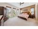 Bright main bedroom with many windows and a neutral color scheme at 5095 E Long Leaf Ct, Pahrump, NV 89061