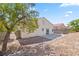 Private backyard featuring rock landscaping, patio, and block wall at 5307 Wild Orchid St, North Las Vegas, NV 89031