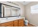 Bathroom with double sinks, vanity, tile floor, large mirror, and a shower visible in the mirror at 5307 Wild Orchid St, North Las Vegas, NV 89031