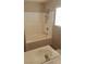 Bathroom features a shower with a tub, single sink vanity, and tile flooring at 5307 Wild Orchid St, North Las Vegas, NV 89031