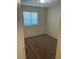 Bright bedroom featuring carpeted floors and a window with blinds at 5307 Wild Orchid St, North Las Vegas, NV 89031