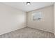 Bedroom with neutral carpet and walls, and a window that provides natural light at 5307 Wild Orchid St, North Las Vegas, NV 89031