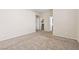 Large bedroom featuring neutral carpet and walls, and a closet, with a bathroom visible through the doorway at 5307 Wild Orchid St, North Las Vegas, NV 89031