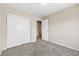Bedroom features neutral walls, plush carpet, and a closet with sliding doors at 5307 Wild Orchid St, North Las Vegas, NV 89031