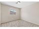 Well-lit bedroom with neutral paint, carpeting, and a window at 5307 Wild Orchid St, North Las Vegas, NV 89031