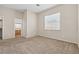 Bedroom with neutral carpet and walls, and a window that provides natural light at 5307 Wild Orchid St, North Las Vegas, NV 89031