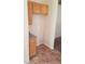 Functional butler's pantry with wooden cabinets and tile floor at 5307 Wild Orchid St, North Las Vegas, NV 89031