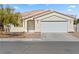 Charming single-story home with a well-maintained yard and attached two-car garage at 5307 Wild Orchid St, North Las Vegas, NV 89031
