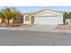 Lovely single-story home with a two-car garage and desert landscaping for low maintenance at 5307 Wild Orchid St, North Las Vegas, NV 89031